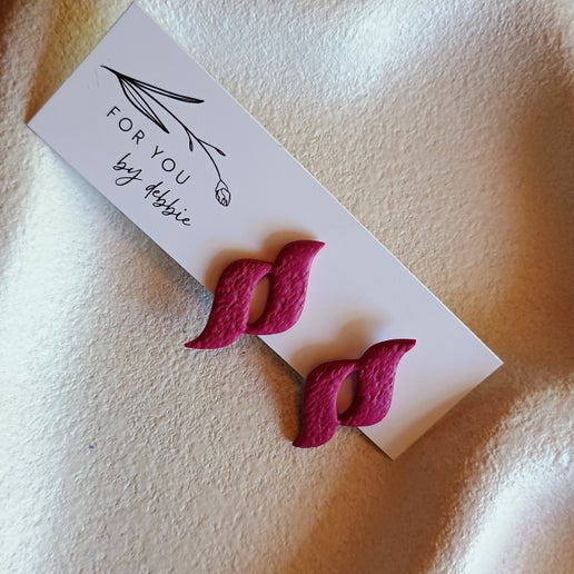 Swirl statement stud - burgundy